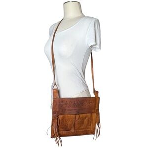Vintage bohemian tooled leather fold over crossbody bag